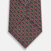 View 3 of product A close-up of the Turnbull & Asser Red and Navy Weave Patterned Silk Tie, showcasing its geometric design in red, blue, white, and yellow on a white background.
