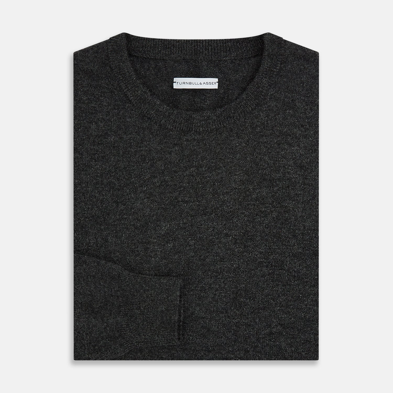 View 4 of product The Turnbull & Asser Dark Grey Cashmere Round Neck Jumper features a classic, plain long-sleeve design and is displayed on a white background.
