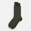 View 2 of product A single forest green mid-length sock from Turnbull & Asser, featuring a motif pattern and crafted from soft mercerised Egyptian cotton, shown against a plain white background.