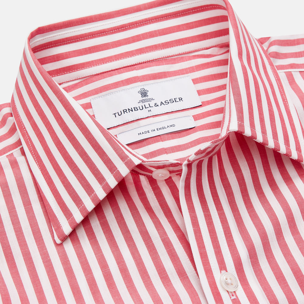 The Pink Candy Stripe Cotton Weekend Fit Finch Shirt by Turnbull & Asser features vertical red and white stripes, a left chest pocket, and a classic collar—an essential men’s wardrobe staple shown against a white backdrop.