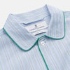 View 2 of product The Turnbull & Asser Blue and Green Stripe Poplin Cotton Nightshirt features long sleeves, a rounded hem, front pocket, green-trimmed collar and pocket, and front buttons—ideal men's nightwear for any season.