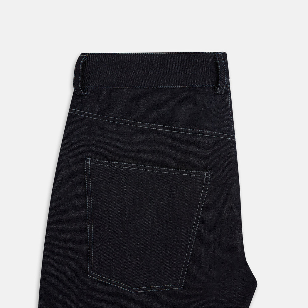 Turnbull & Asser Navy Denim Trousers feature a classic straight-leg cut, button and zipper closure, five-pocket workwear styling, and both front and back pockets, shown against a plain light background.