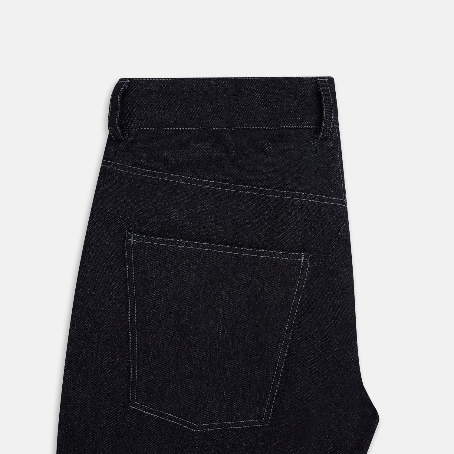 View 5 of product Turnbull & Asser Navy Denim Trousers feature a classic straight-leg cut, button and zipper closure, five-pocket workwear styling, and both front and back pockets, shown against a plain light background.