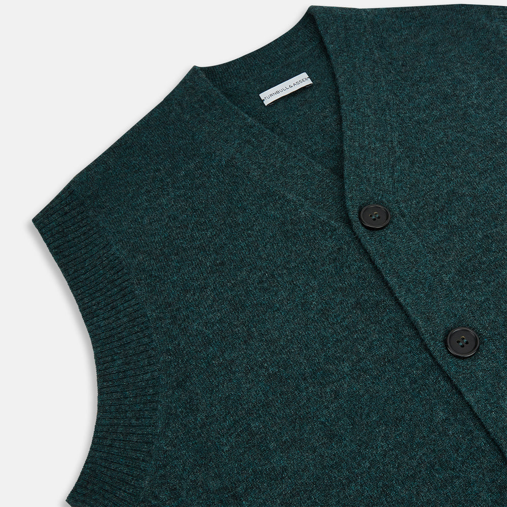 The Turnbull & Asser Forest Green Melange Cashmere Sleeveless Cardigan features a button-up front, two pockets, ribbed hem, and round neckline, shown on a white background.