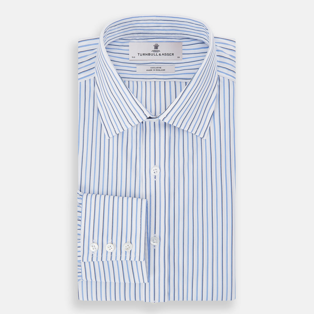 The Blue and Navy Double Stripe Mayfair Shirt by Turnbull & Asser features a classic T&A collar and thin blue stripes on a white background, displayed against a plain white surface.