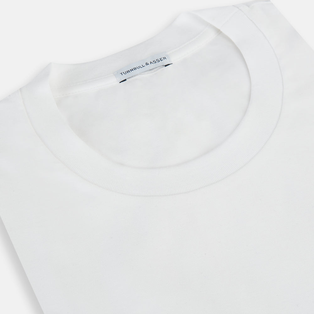 Experience comfort in the Turnbull & Asser White Short-sleeve Pyjama Shirt—a plain crew neck T-shirt laid flat on a white background, perfect as elevated loungewear or a sleek pyjama essential.