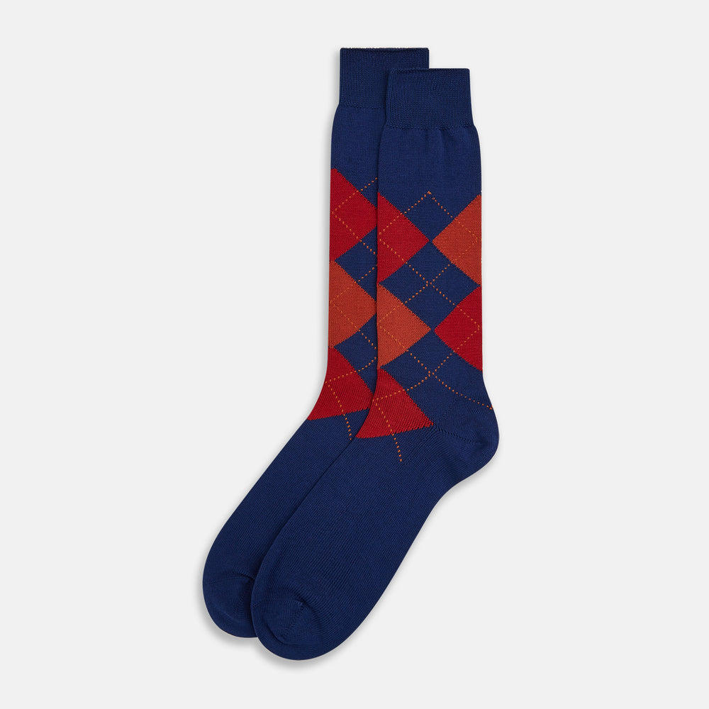 Turnbull & Asser’s Royal Blue Check Mid-Length Sock features a blue base with red, orange, and blue checks on the calf, shown against a plain white background.