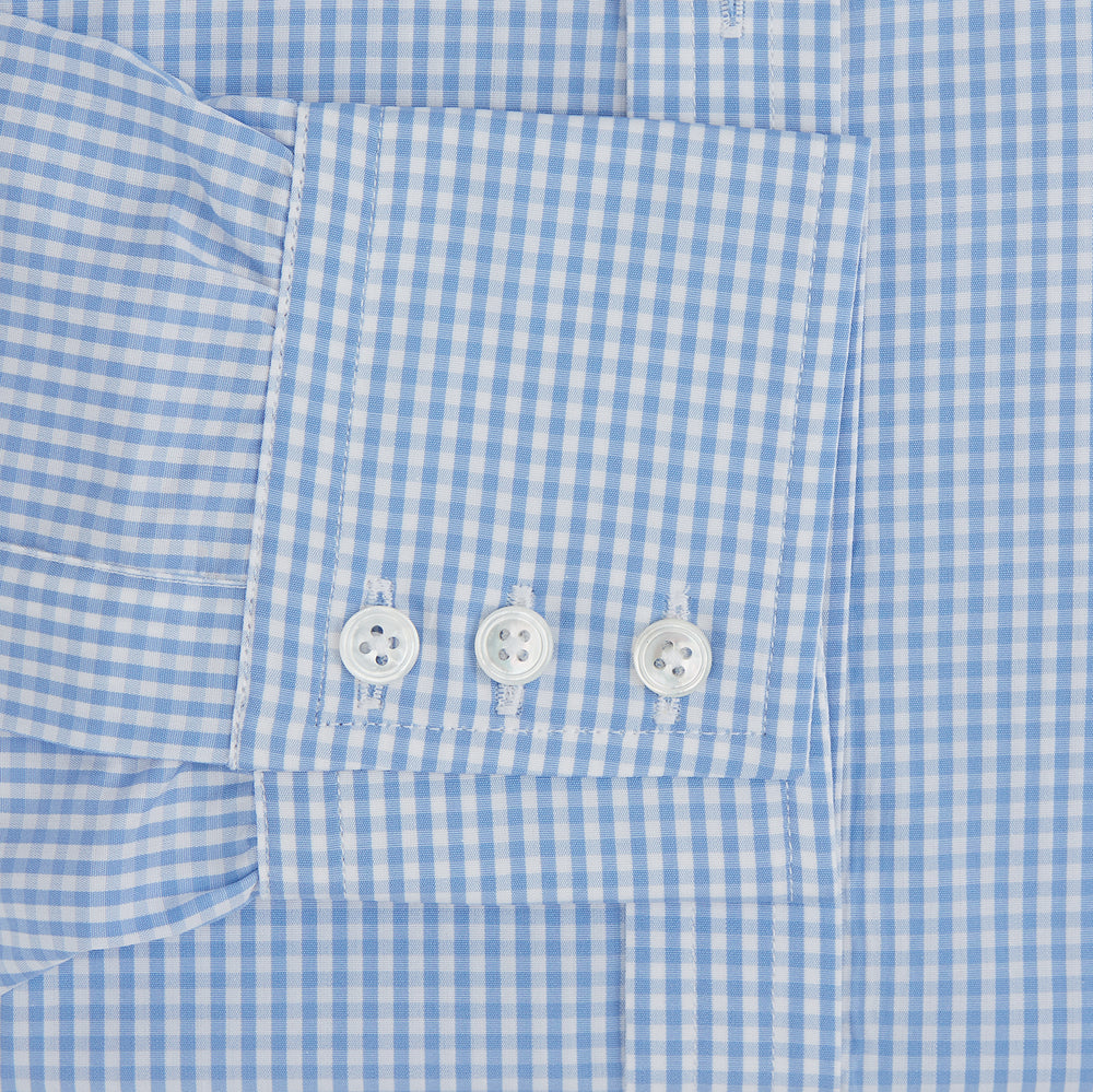 The Turnbull & Asser Light Blue Gingham Check Shirt features a T&A collar, 3-button cuffs, classic gingham pattern, and white buttons down the front, shown laid flat on a white background.
