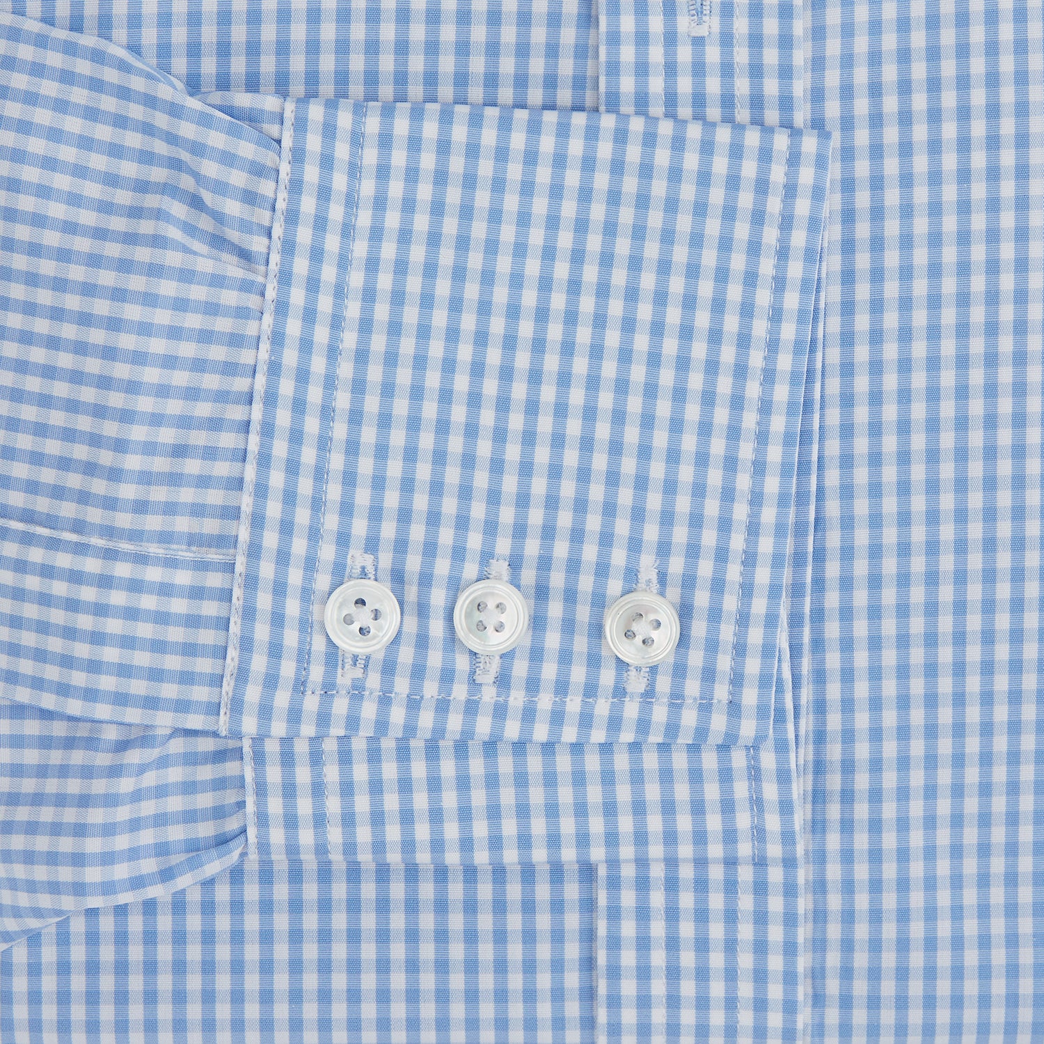 View 3 of product The Turnbull & Asser Light Blue Gingham Check Shirt features a T&A collar, 3-button cuffs, classic gingham pattern, and white buttons down the front, shown laid flat on a white background.