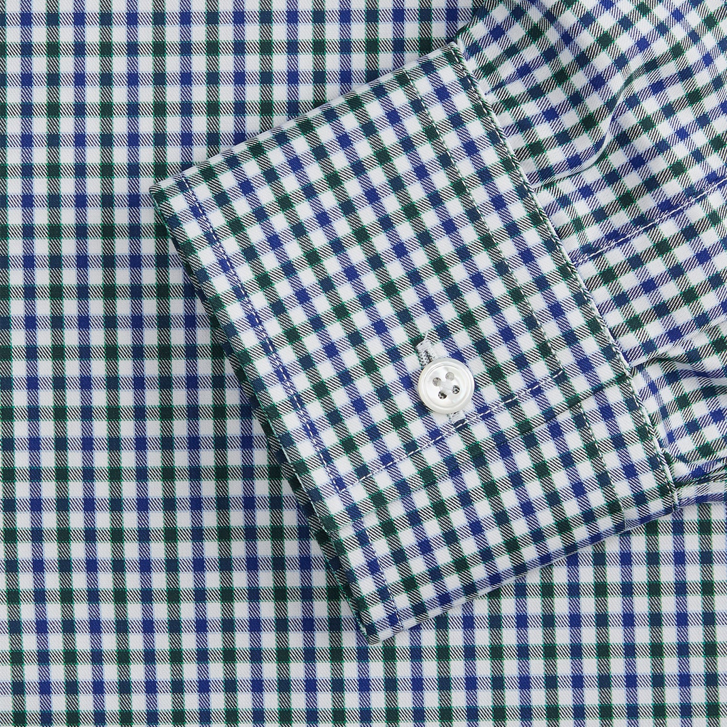View 3 of product The Turnbull & Asser Green and Blue Cotton Multi Check Weekend Fit Finch Shirt features long sleeves, a pointed collar, and buttoned cuffs—perfect for versatile style. Laid flat on a white background.