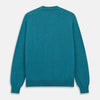 View 3 of product The Teal Lachlan Cashmere Cardigan by Turnbull & Asser features long sleeves, front pockets, and ribbed hem and cuffs. Displayed flat on a white background, this cozy piece is inspired by classic Scottish knitwear.