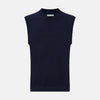 View 1 of product The Turnbull & Asser Navy Fine Merino V-Neck Vest is a sleeveless sweater exuding sophistication with its classic design, shown on a plain white background.