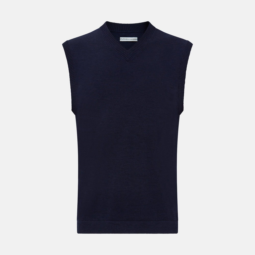 The Turnbull & Asser Navy Fine Merino V-Neck Vest is a sleeveless sweater exuding sophistication with its classic design, shown on a plain white background.