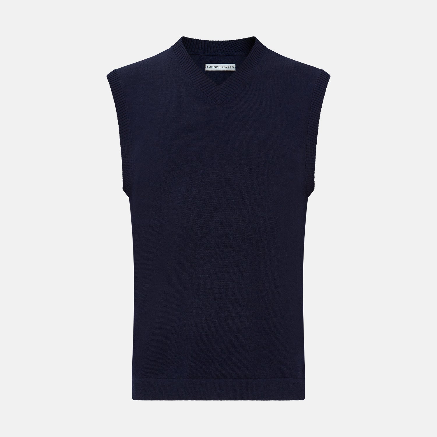 View 1 of product The Turnbull & Asser Navy Fine Merino V-Neck Vest is a sleeveless sweater exuding sophistication with its classic design, shown on a plain white background.