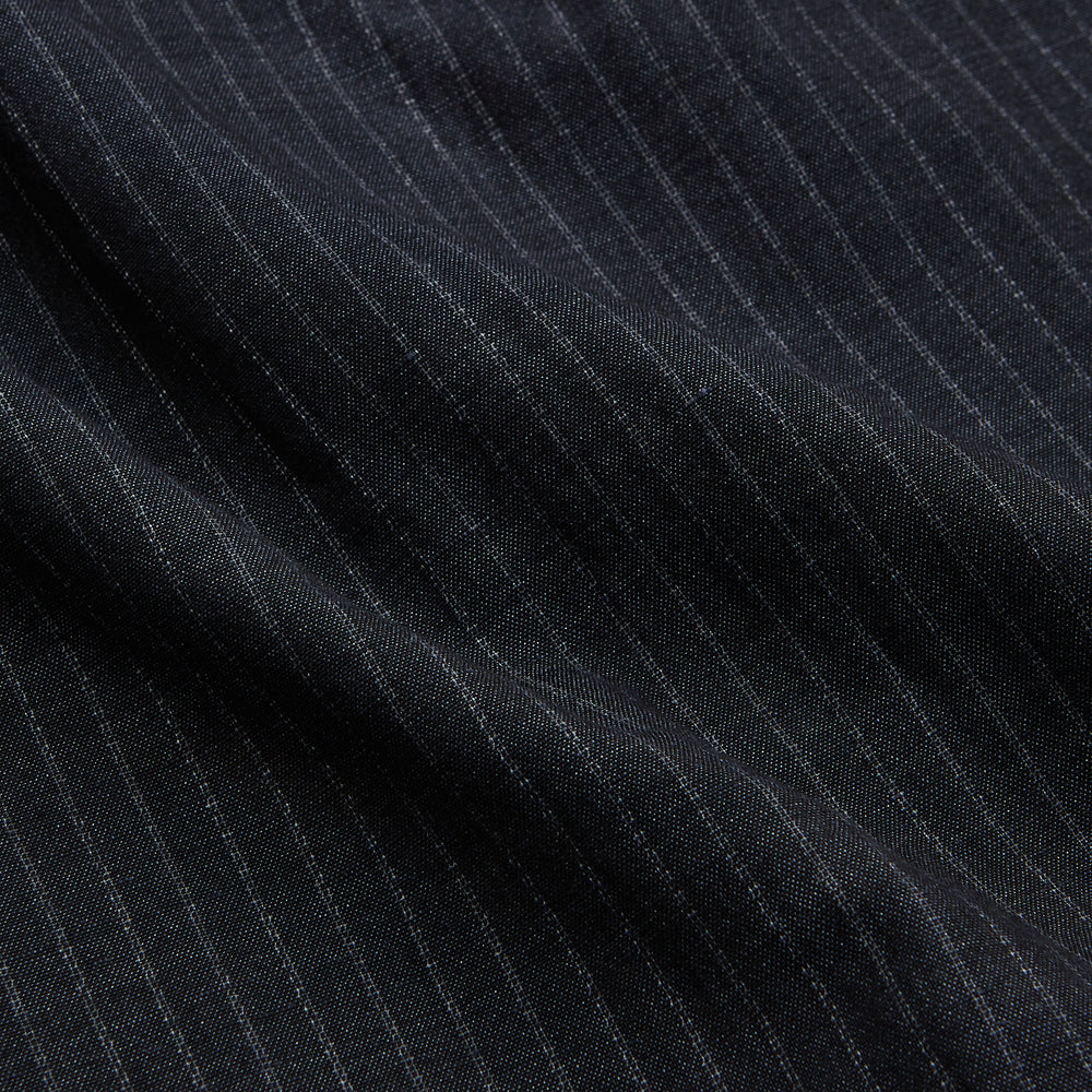 The Navy Tailored Pinstriped Shirt Jacket by Turnbull & Asser is a smart-casual, lightweight cotton-linen piece with long sleeves, a collar, left chest pocket, and front buttons for easy style.