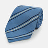 View 1 of product The Blue Multi Stripe Silk Blend Tie by Turnbull & Asser features diagonal navy and light beige stripes, shown rolled up on a white background—a timeless formal accessory.