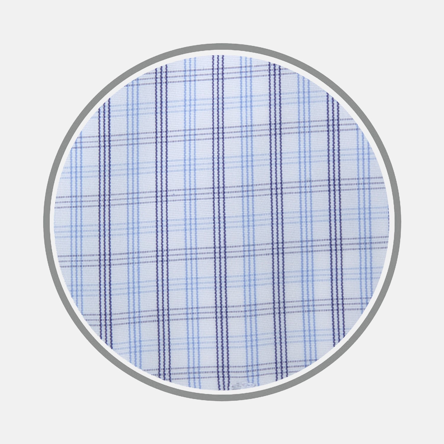 View 1 of product Close-up of Turnbull & Asser's Navy Group Check Cotton Fabric, featuring a light blue base with intersecting navy and light blue lines in a plaid pattern, displayed in a circular frame on a white background.