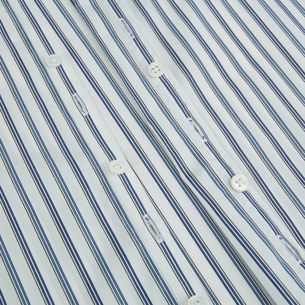 The SAPPHIRE BLUE MULTI TRACK STRIPE WINDSOR SHIRT by Turnbull & Asser features long sleeves, button-up front, classic collar, blue and white vertical stripes, buttoned cuffs, and showcases British craftsmanship on a white background.