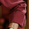 View 5 of product The Turnbull & Asser Burgundy Silk Shirt features a T&A collar and 3-button cuffs, offering a refined alternative to a black tie for modern style. Displayed folded on a white background.