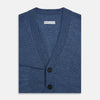 View 4 of product Turnbull & Asser Blue Cashmere Cardigan in soft knit, with black buttons, ribbed cuffs and hem, and two front pockets in vibrant colours—shown on a plain white background.