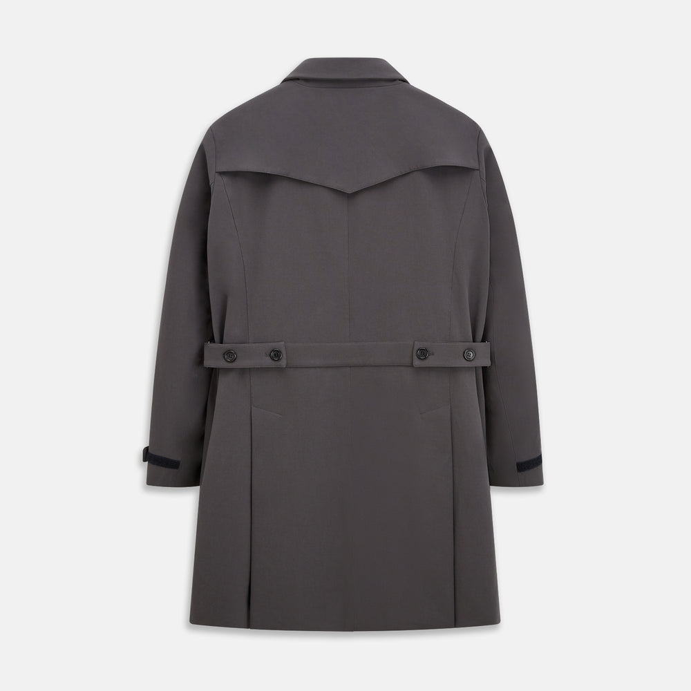 The Turnbull & Asser Charcoal Melange John Arthur Trench Coat, featuring a collar, single-breasted closure, and three zippered pockets—one chest and two at the hips—is shown against a plain white background.