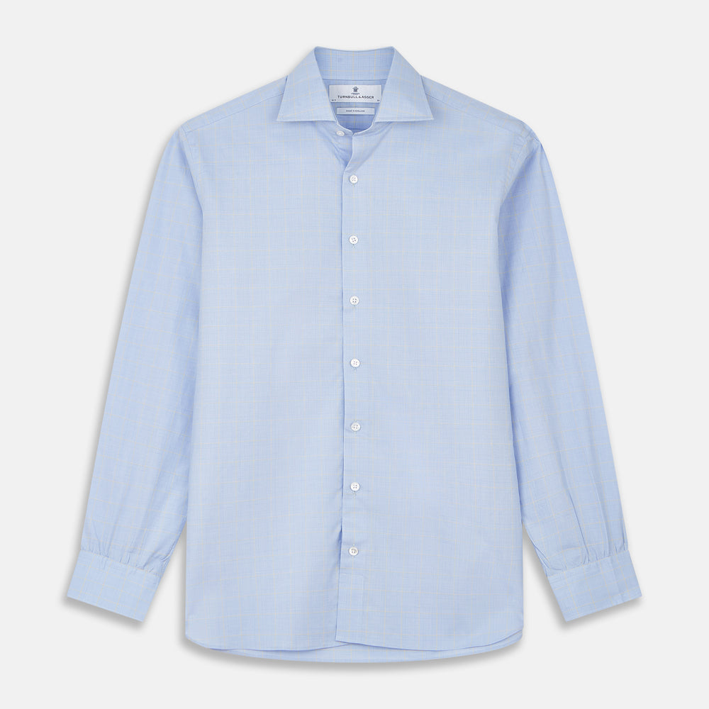 The Yellow and Blue Prince of Wales Check Belgravia Shirt by Turnbull & Asser features a classic collar, white buttons, long sleeves, and a checked pattern, displayed laid flat on a white background.