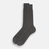 View 2 of product A single Concrete Mid-Length Sock by Turnbull & Asser, crafted from mercerised Egyptian cotton for refined comfort, is shown upright on a white background with the toe pointing left and the cuff at the top.