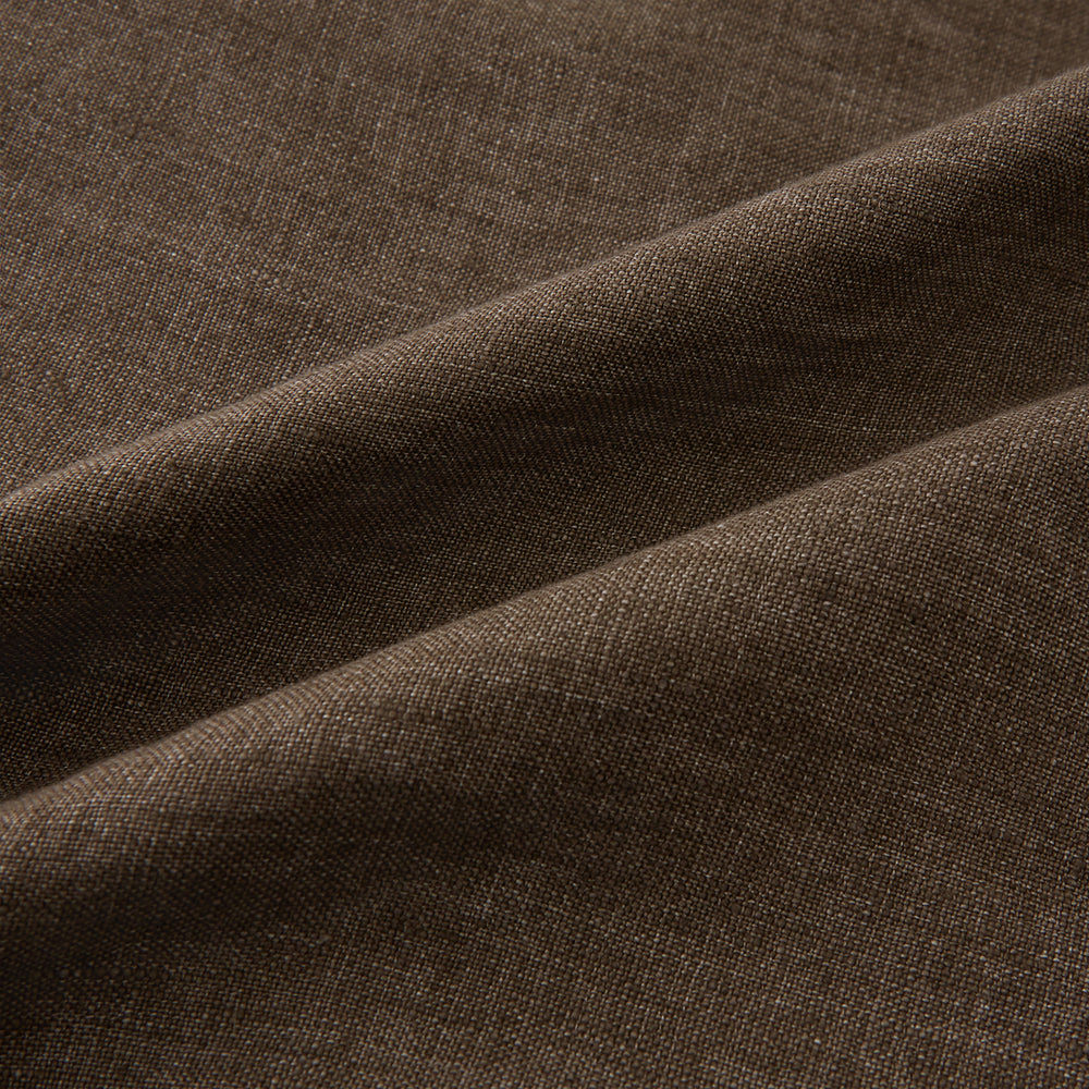 The Pine Cone Linen Holland Shacket by Turnbull & Asser is a brown men's lightweight outerwear piece with a collar, long sleeves, three front zip pockets, and black buttons, shown on a white background.