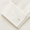 View 4 of product The Turnbull & Asser Cream Weekend Fit Hayne Shirt features a Dorset collar and 1-button cuffs, displayed long-sleeved and laid flat on a white background.