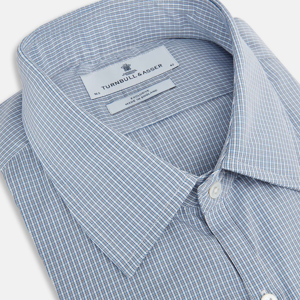 The Turnbull & Asser Blue and Brown Micro Shadow Check Westminster Shirt features a refined collar and white buttons, showcasing timeless British craftsmanship.