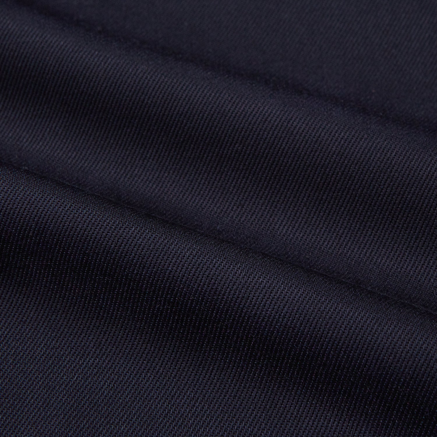 View 5 of product A Navy Cotton Holiday Fit Winnington Shirt by Turnbull & Asser, featuring long sleeves, a chest pocket, white buttons, and a revere collar, is laid flat on a white background.
