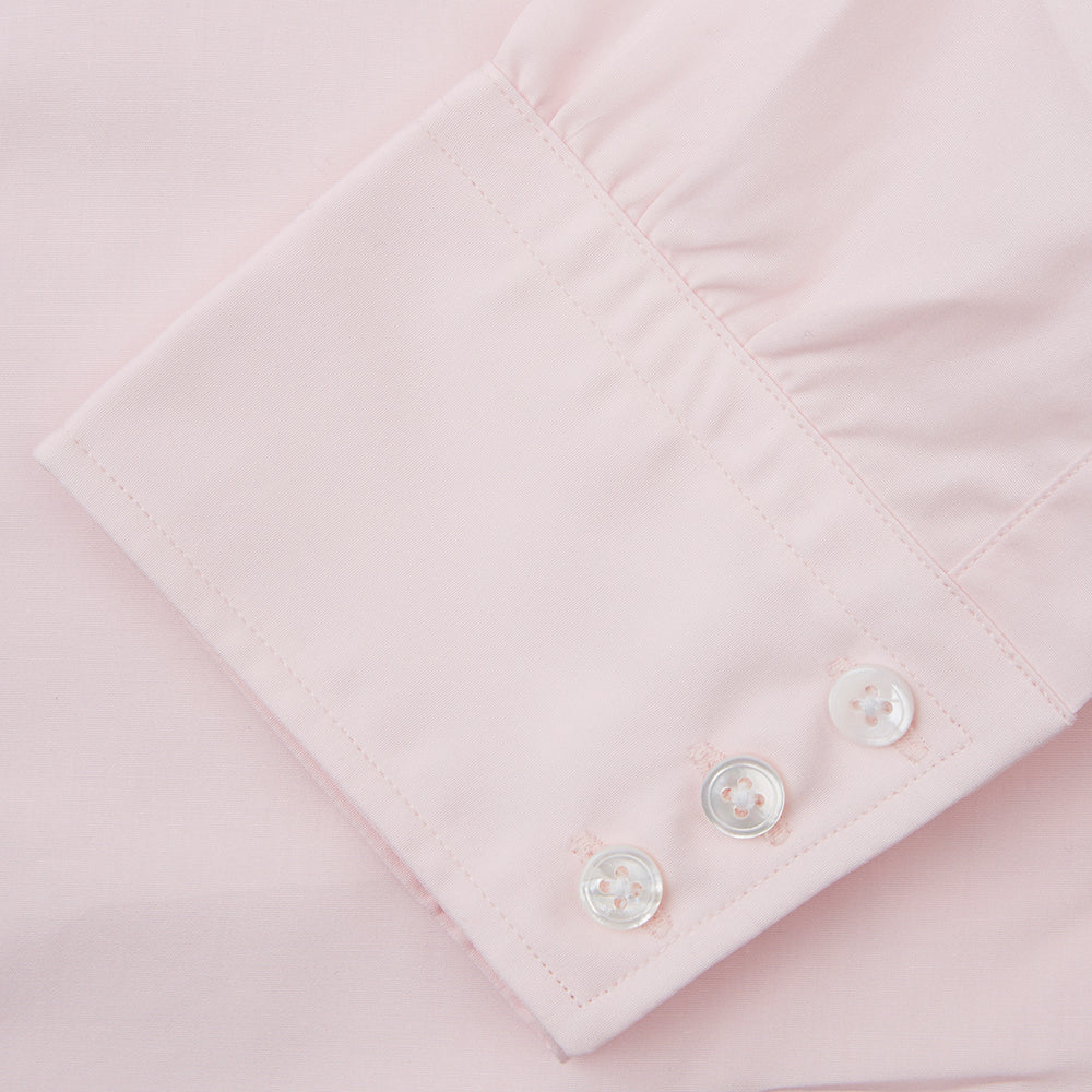 The Turnbull & Asser Pink Cotton Shirt features a T&A collar, 3-button cuffs, and a clean-cut design, displayed neatly folded against a plain white background.