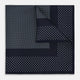The Turnbull & Asser Navy and Light Blue Dot Silk Pocket Square features white polka dots, a contrasting border, and an inner square design, showcasing handmade craftsmanship with its expertly folded finish.