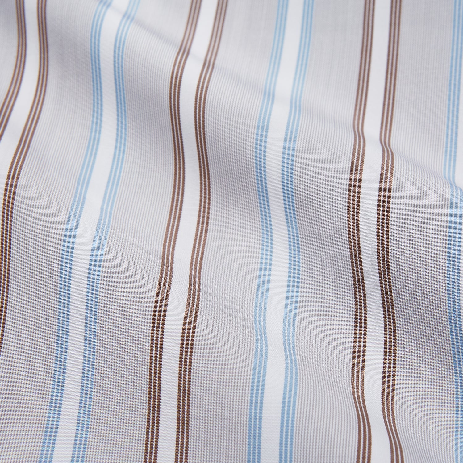 View 4 of product Turnbull & Asser's Beige Multi Stripe Cotton Regular Fit Penrose Shirt features blue, beige, and white vertical stripes with a crisp white collar and cuffs. Displayed on a plain background.