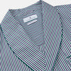 View 2 of product The Turnbull & Asser Green and Blue Stripe Cotton Arnold Gown features long sleeves, a knee-length cut, a shawl collar, front pockets, and an elegant wrap belt at the waist.
