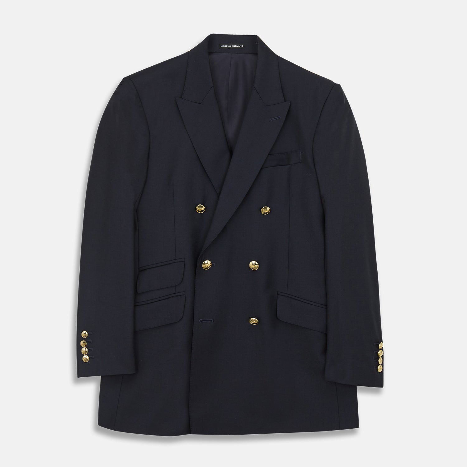 View 1 of product The Turnbull & Asser Navy Plain Wool Double Breasted Blazer features a nautical-inspired design with gold buttons, peaked lapels, and flap pockets, shown against a white background.