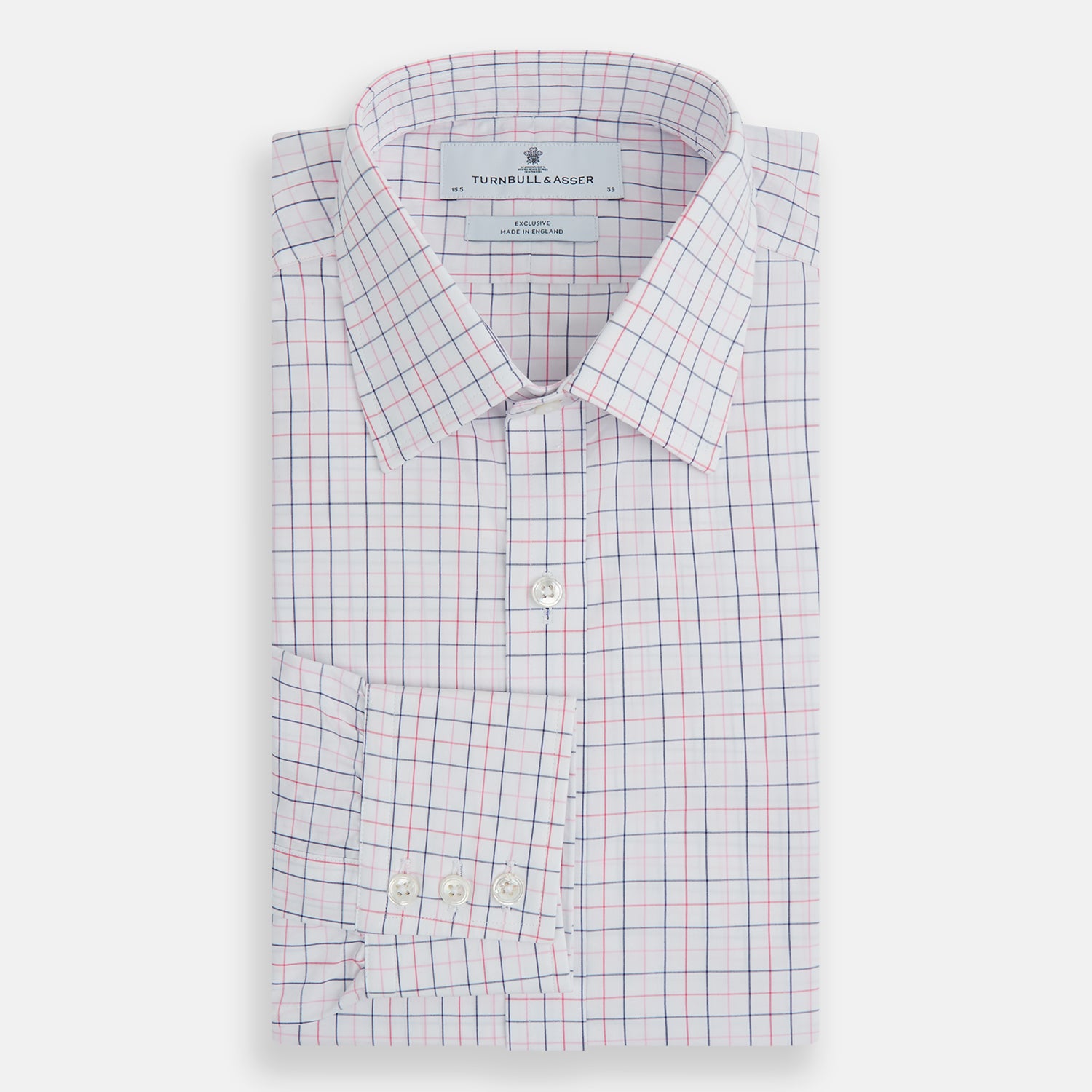 View 5 of product The Turnbull & Asser Pink Overlay Grid Check Mayfair Shirt is a long-sleeved, button-up with a collar and buttoned cuffs, featuring a white base and thin pink grid lines. Laid flat against a white surface.