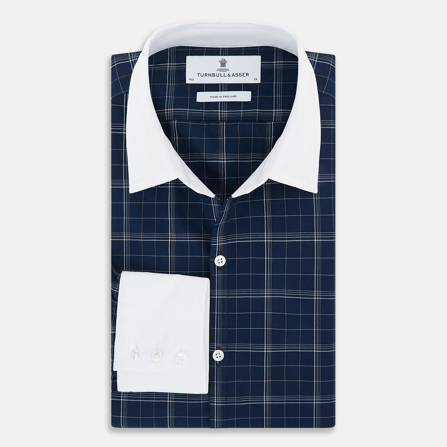 View 5 of product The Turnbull & Asser Indigo Windowpane Check Windsor Shirt features a contrast T&A collar and cuffs, highlighting British craftsmanship. It is displayed flat on a white background.