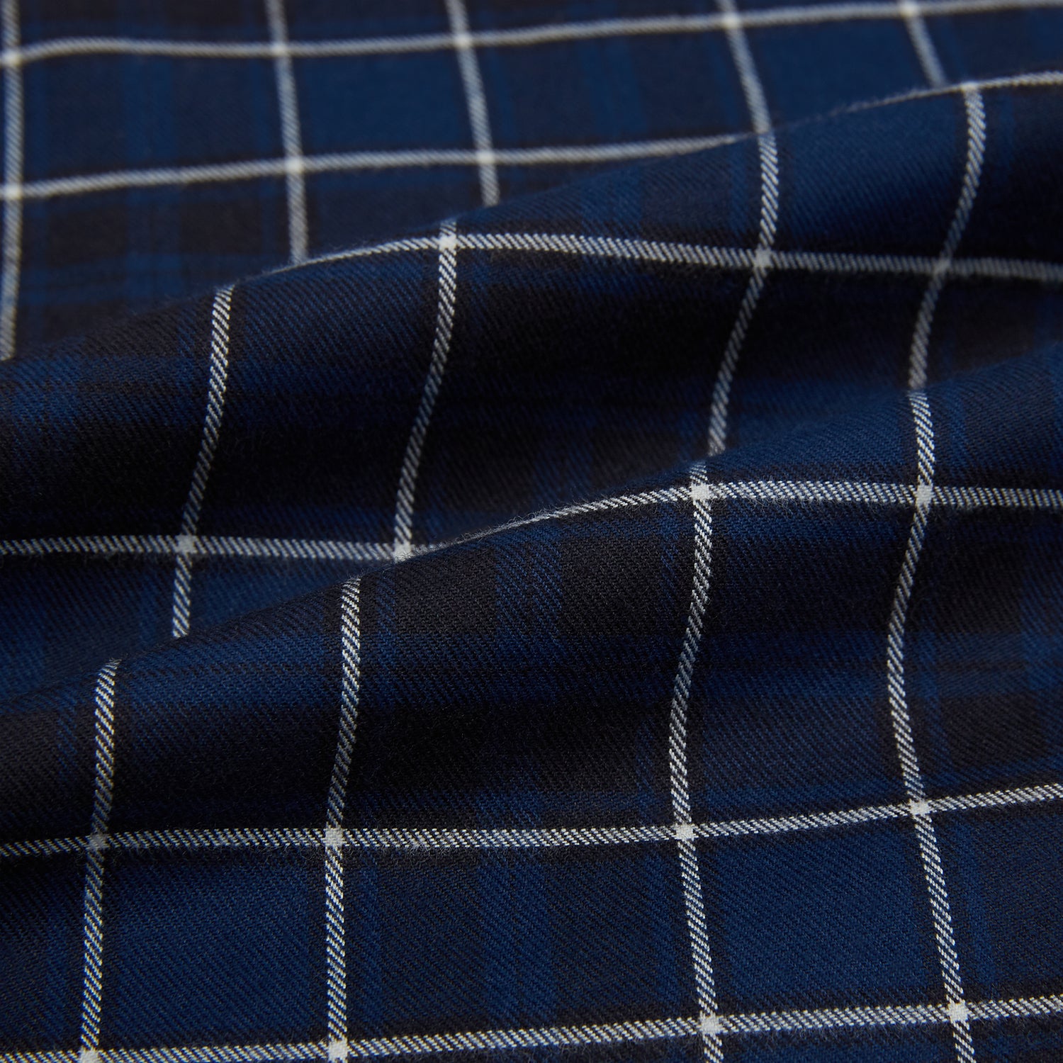 View 8 of product The Turnbull & Asser Navy and White Check Windsor Shirt features a long-sleeve design with a navy base and white check pattern, showcasing British craftsmanship and displayed on a white background.