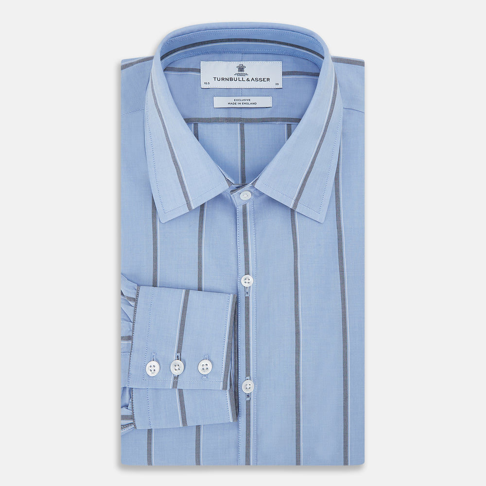 The Sky Blue Track Stripe Westminster Shirt by Turnbull & Asser features long sleeves, a Turnbull collar, and vertical dark blue and white stripes, displayed flat on a white surface.