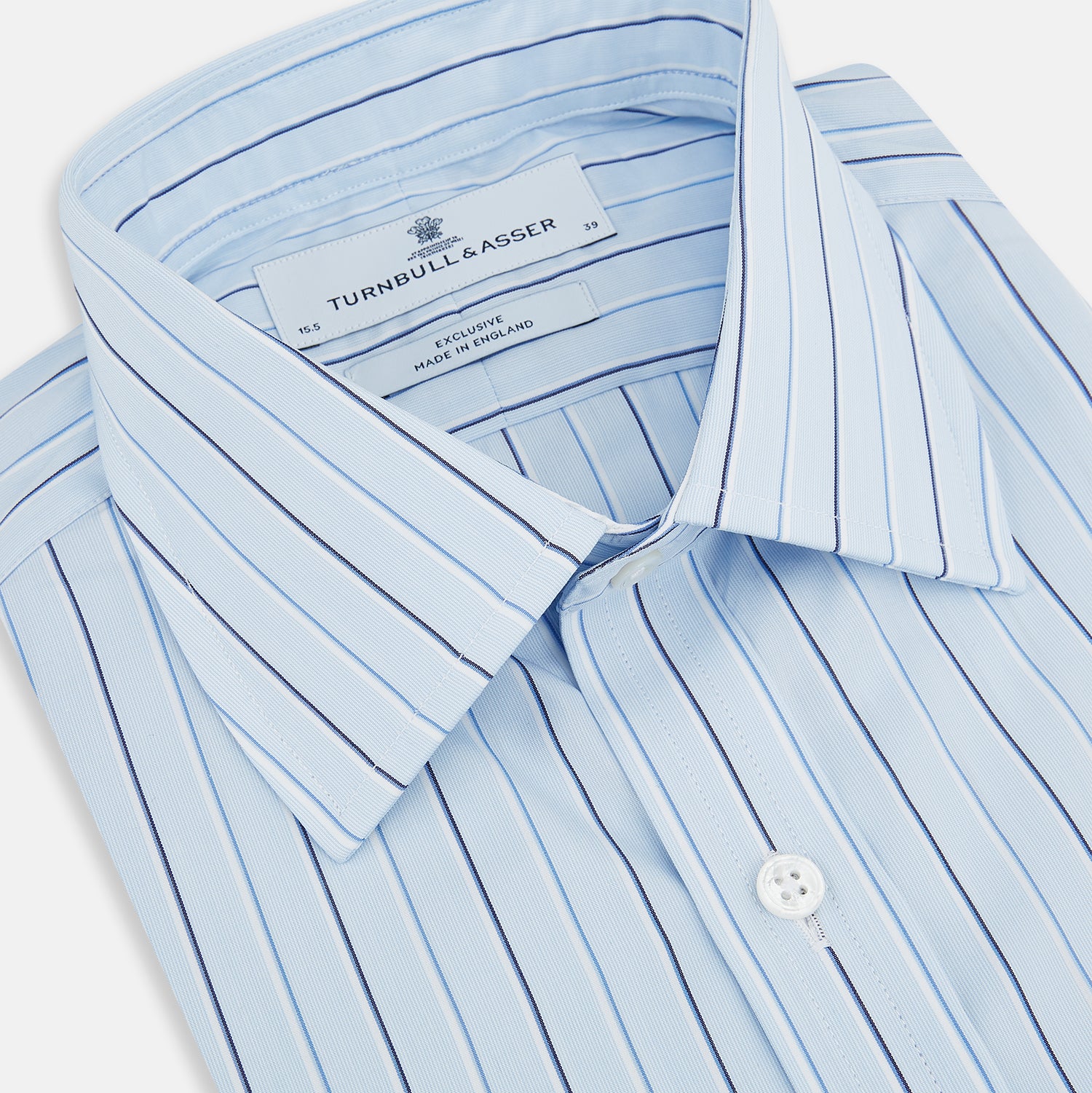 View 2 of product The Turnbull & Asser Navy and Blue Combination Stripe Mayfair Shirt, featuring thin vertical stripes and a classic collar, is displayed laid flat on a white background.