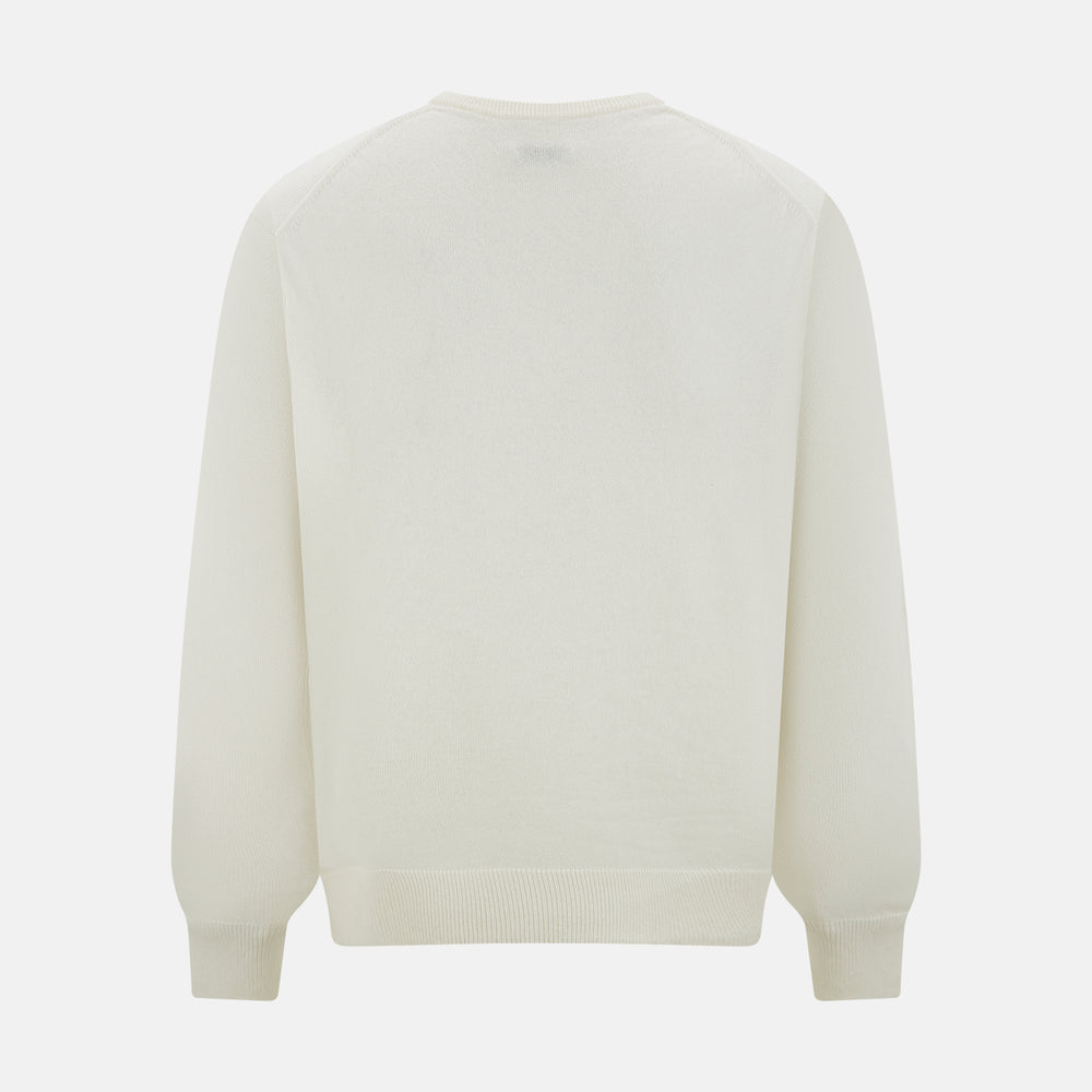 The Turnbull & Asser Ivory Cashmere V-neck Jumper features long sleeves with ribbed cuffs and hem, showcasing timeless knitwear style against a white background.
