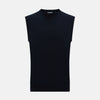 View 1 of product The Navy Cashmere Round Neck Vest by Turnbull & Asser is an elegant men's sleeveless knit, featuring a crew neck and ribbed hem. Perfect as a light layer, it is displayed against a plain white background.