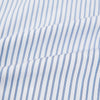 View 6 of product The Turnbull & Asser Navy Double Pinstripe Mayfair Shirt is a long-sleeve, button-up collared shirt with thin vertical blue and white stripes, shown against a plain white background.