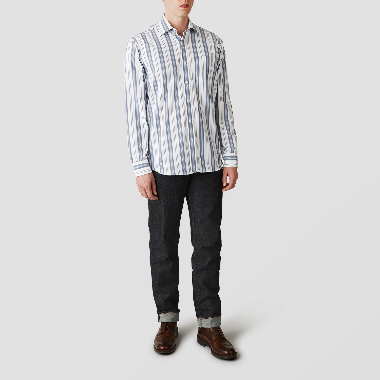 View 2 of product The Turnbull & Asser Blue, Green & White Stripe Weekend Fit Shirt features a Derby collar, 1-button cuffs, and a classic striped design—ideal for winter layering. Displayed on a plain white background.