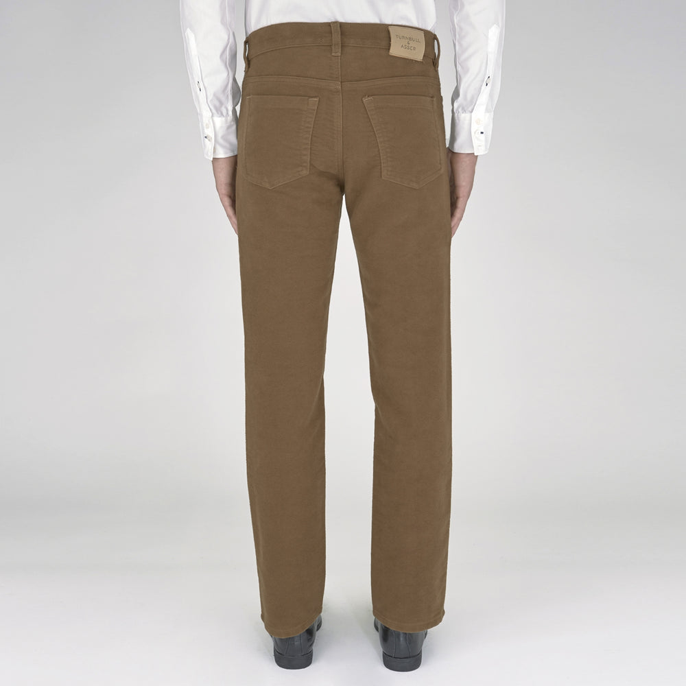 A pair of yellow cotton plain 5 pocket jeans by Turnbull & Asser, featuring a button and zip closure, displayed on a plain white background.