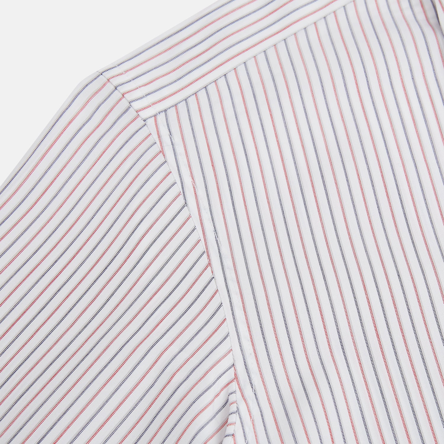View 6 of product The Turnbull & Asser Red and Blue Double Stripe Westminster Shirt is a long-sleeved, button-up dress shirt with a formal collar, featuring narrow red and blue stripes on white, shown against a plain white background.