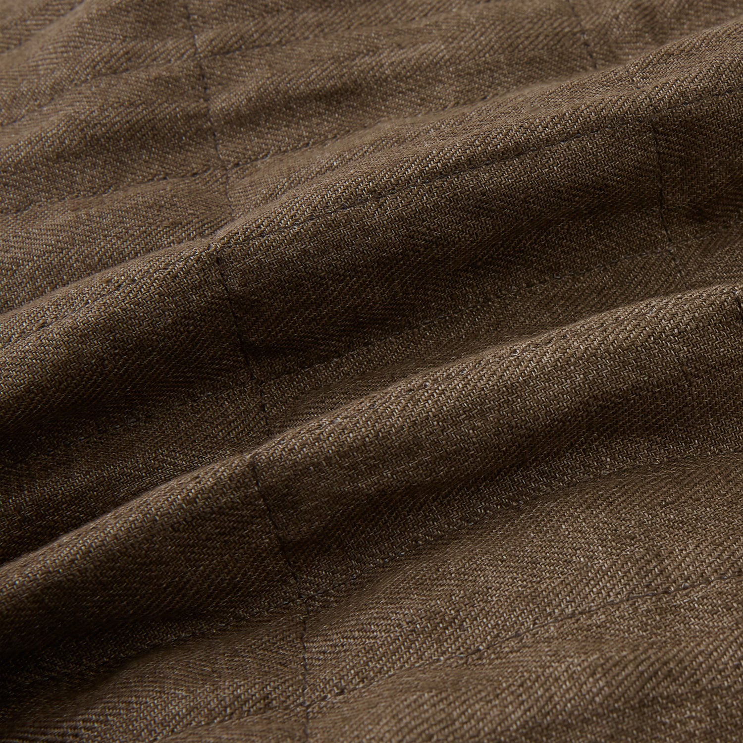 View 5 of product The Turnbull & Asser Pine Cone Quilted Linen Herringbone Waistcoat features a brown, sleeveless design with dark buttons, two angled side pockets, and a chest pocket, shown on a plain white background.