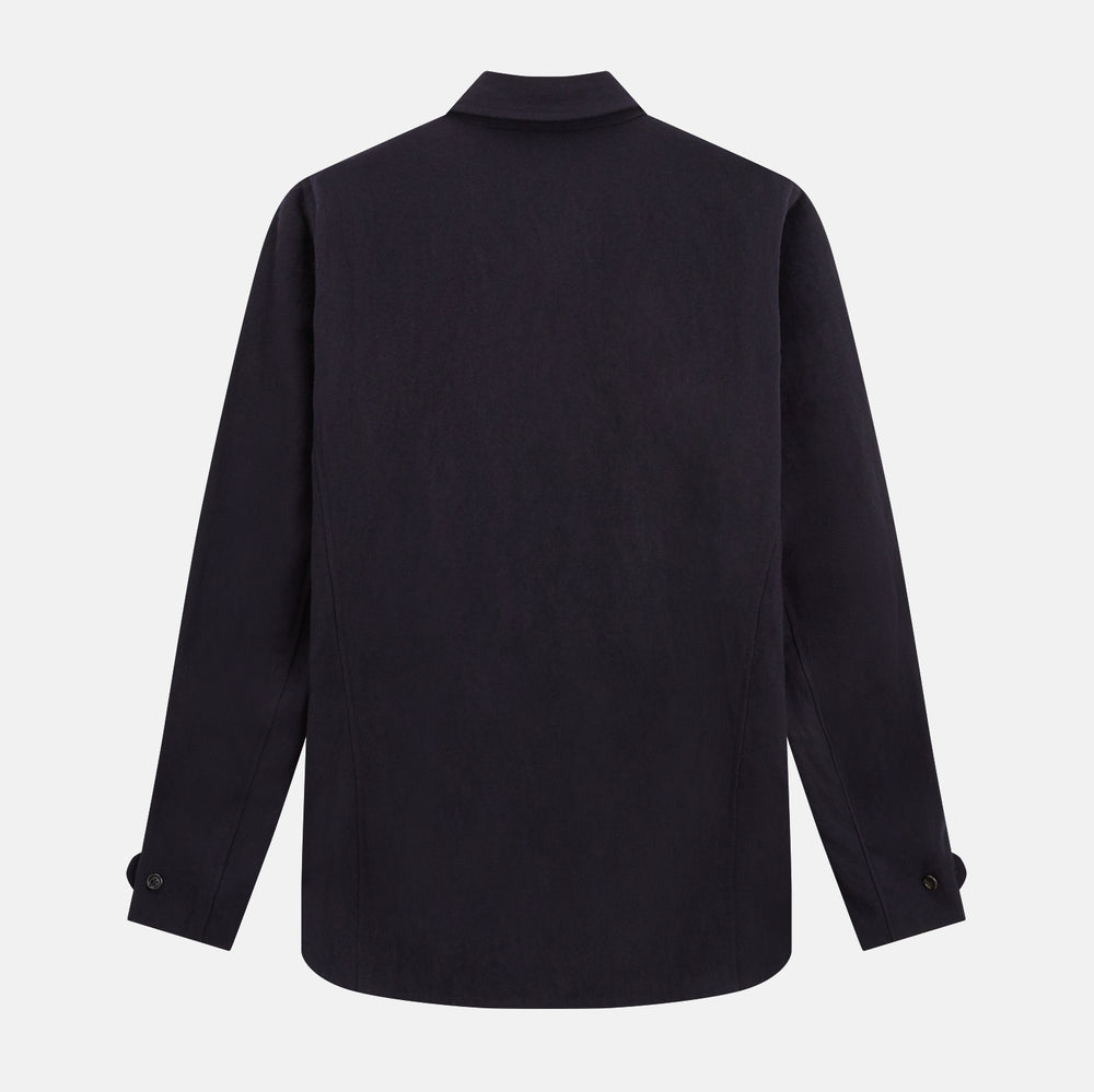 A navy button-up Primrose overshirt by Turnbull & Asser with a classic collar, two side pockets, a left chest pocket, and buttoned cuffs—an ideal blazer alternative, shown on a plain white background.