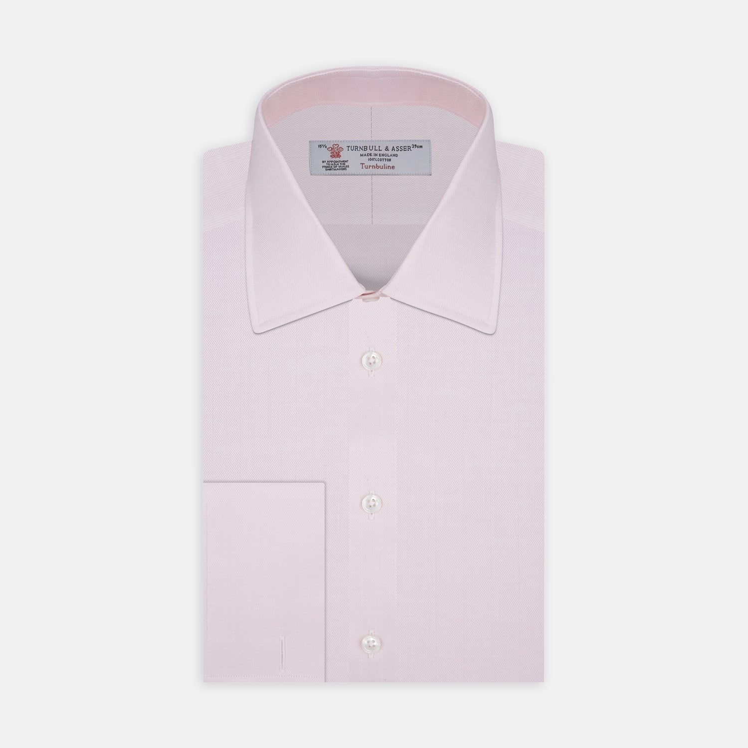 View 1 of product The Turnbull & Asser Pink Herringbone Superfine Cotton Shirt features a T&A collar, double cuffs, and clean-cut design, displayed neatly folded against a white background.